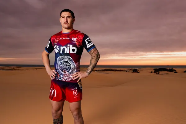 A player full length on the dunes in the Nginhabulagu jersey