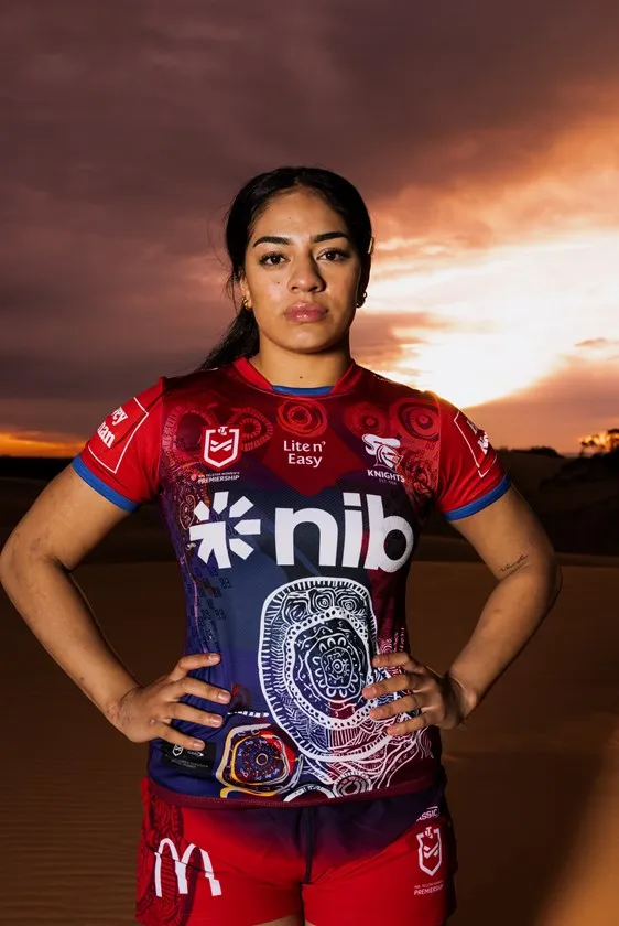 An NRLW player in the Nginhabulagu jersey, hands on hips