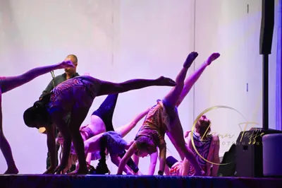 Dancers on stage in Midnight Dreaming uniforms