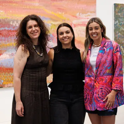 A painting by Renae Lamb held by the group who worked on it together