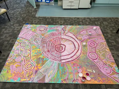 A painting by Renae Lamb in progress on the studio table