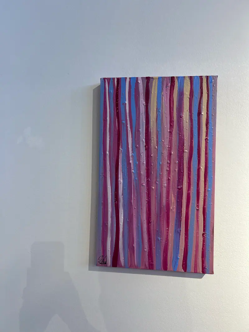 Woven pieces by Renae Lamb, hung with feathers