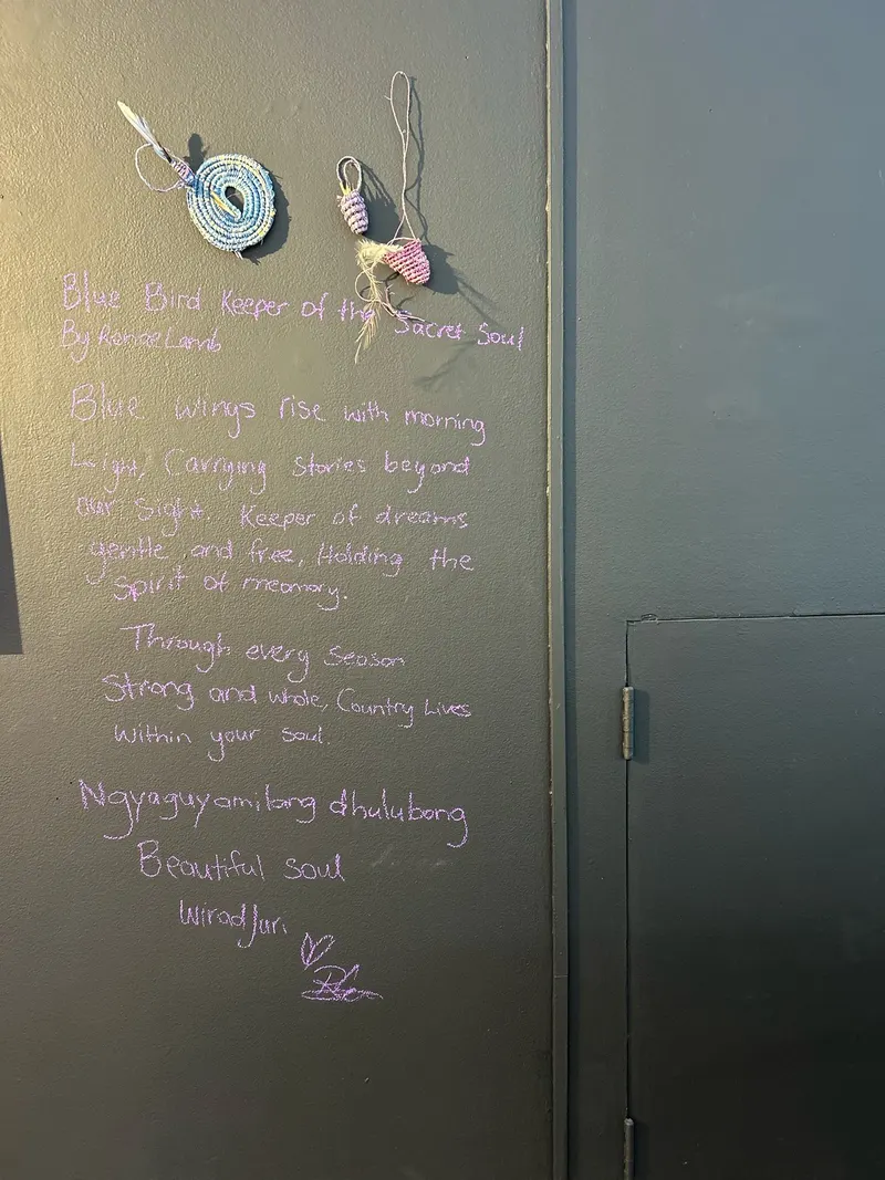 Woven pieces by Renae Lamb hung beside her handwritten poem, Blue Bird Keeper of the Sacred Soul