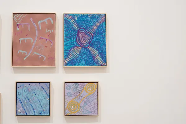 Four small works by Renae Lamb hung as a group